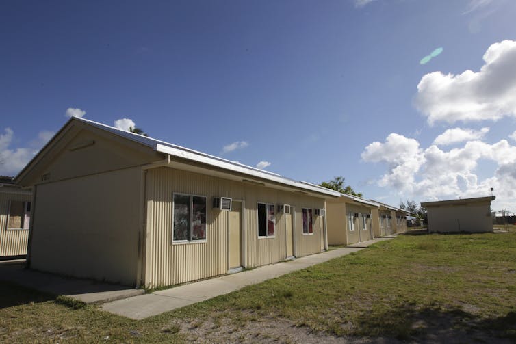 A cream coloured corrugated steel building
